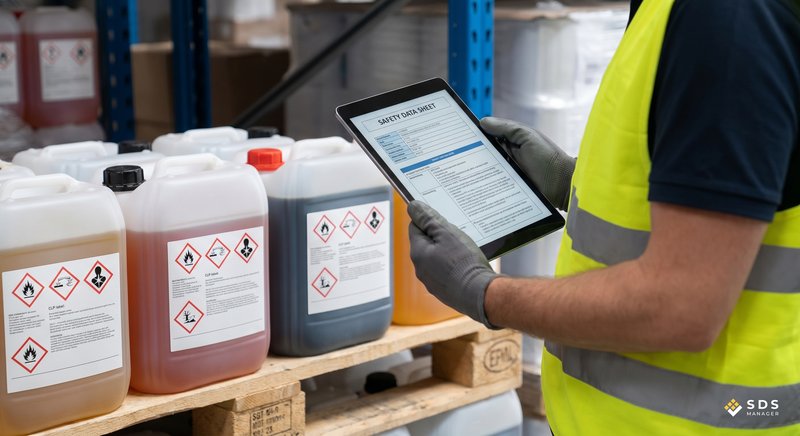 Warehouse worker, checking containers for CLP symbols against SDS